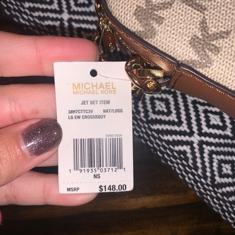 Crossbody is BRAND NEW WITH TAGS! - Picture 2 of 2